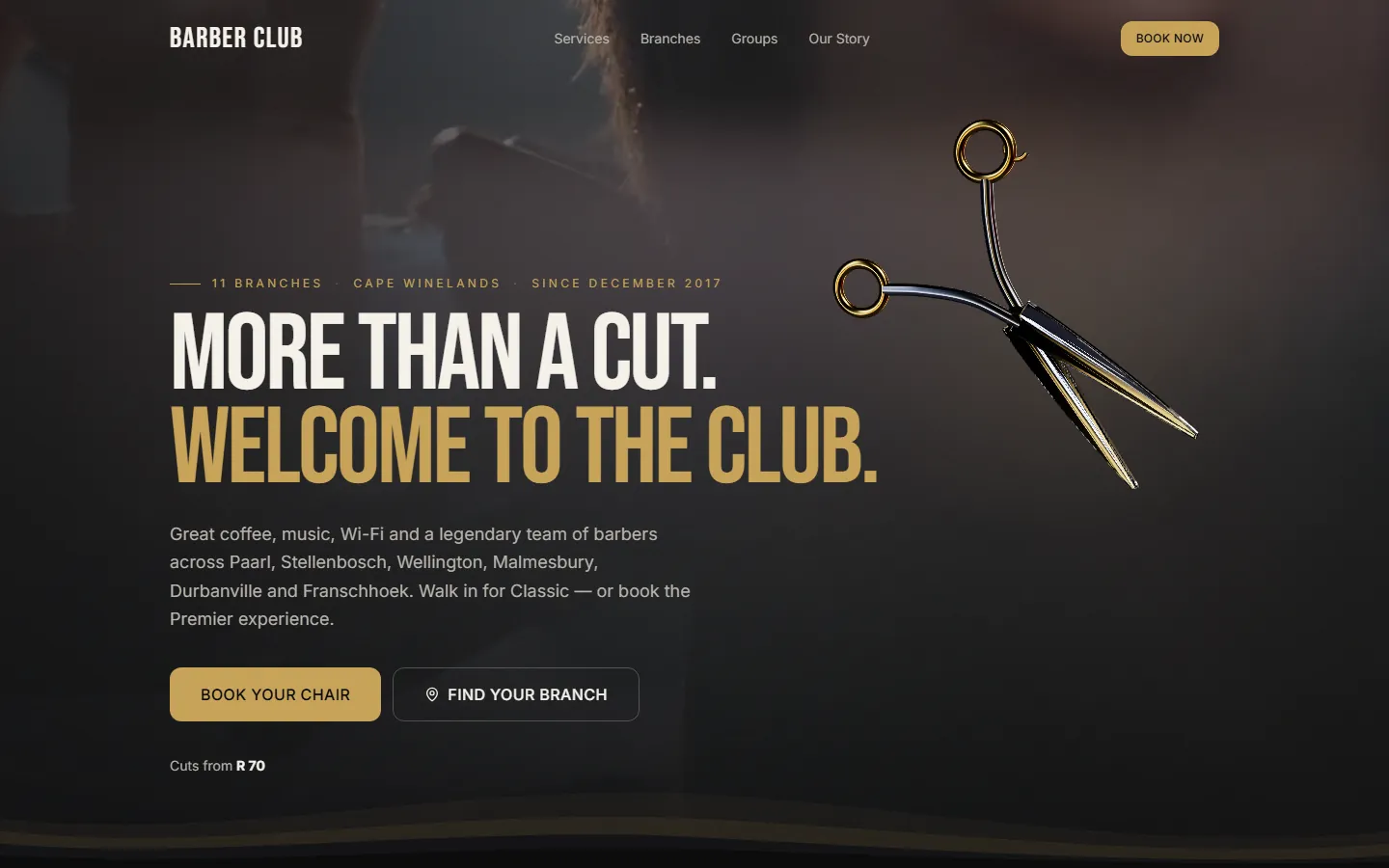 The home page of the Barber Club rebuild: a dark hero with gold type and a pair of scissors